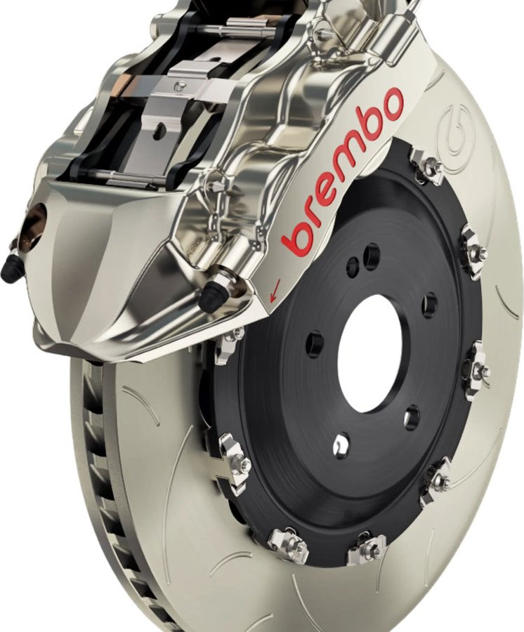 Disc brake caliper and pad assembly on a workbench